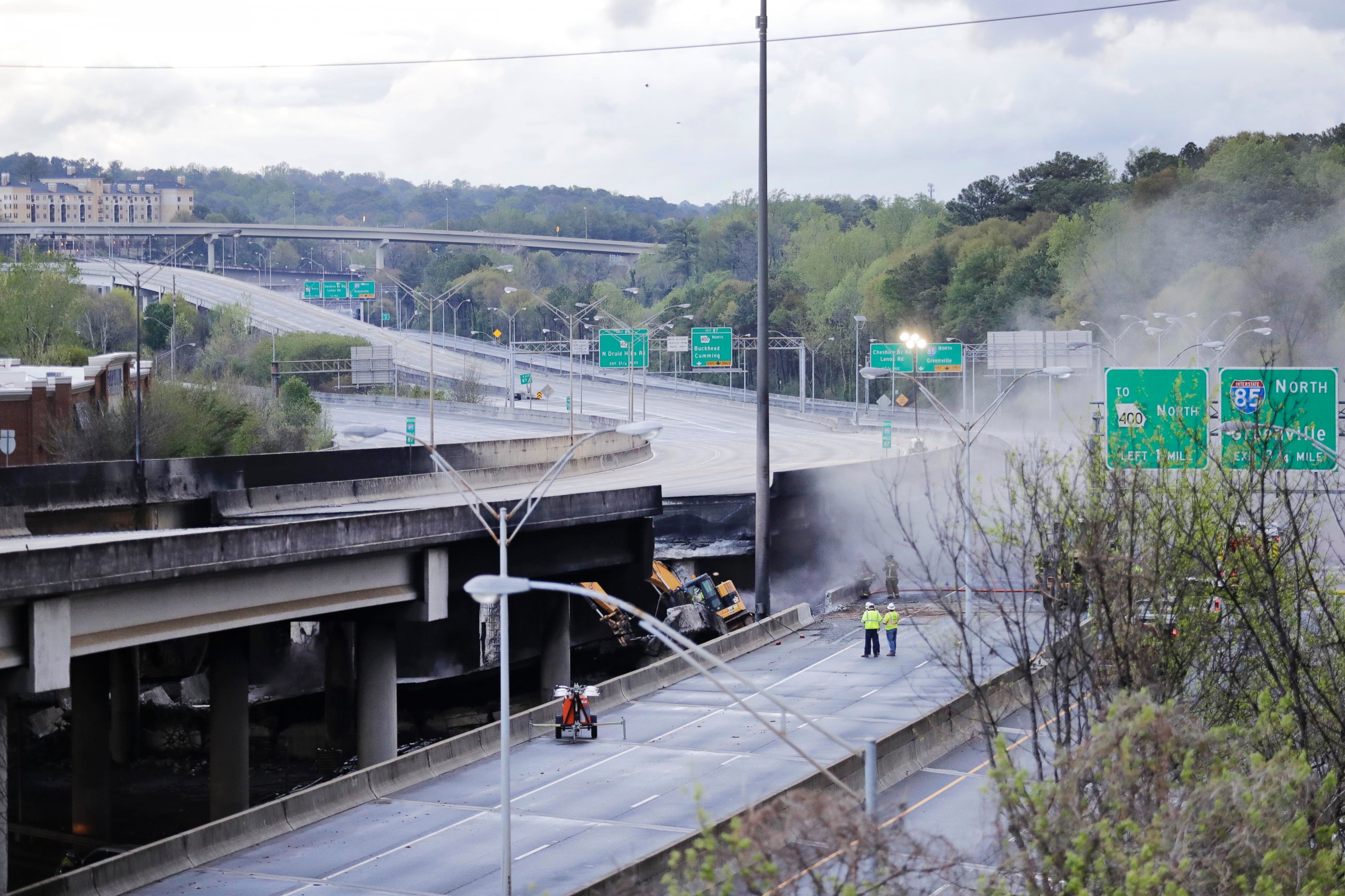 PHOTO: Crews work on a section of an overpass that collapsed from a large fire on Interstate 85 in Atlanta, March 31, 2017.