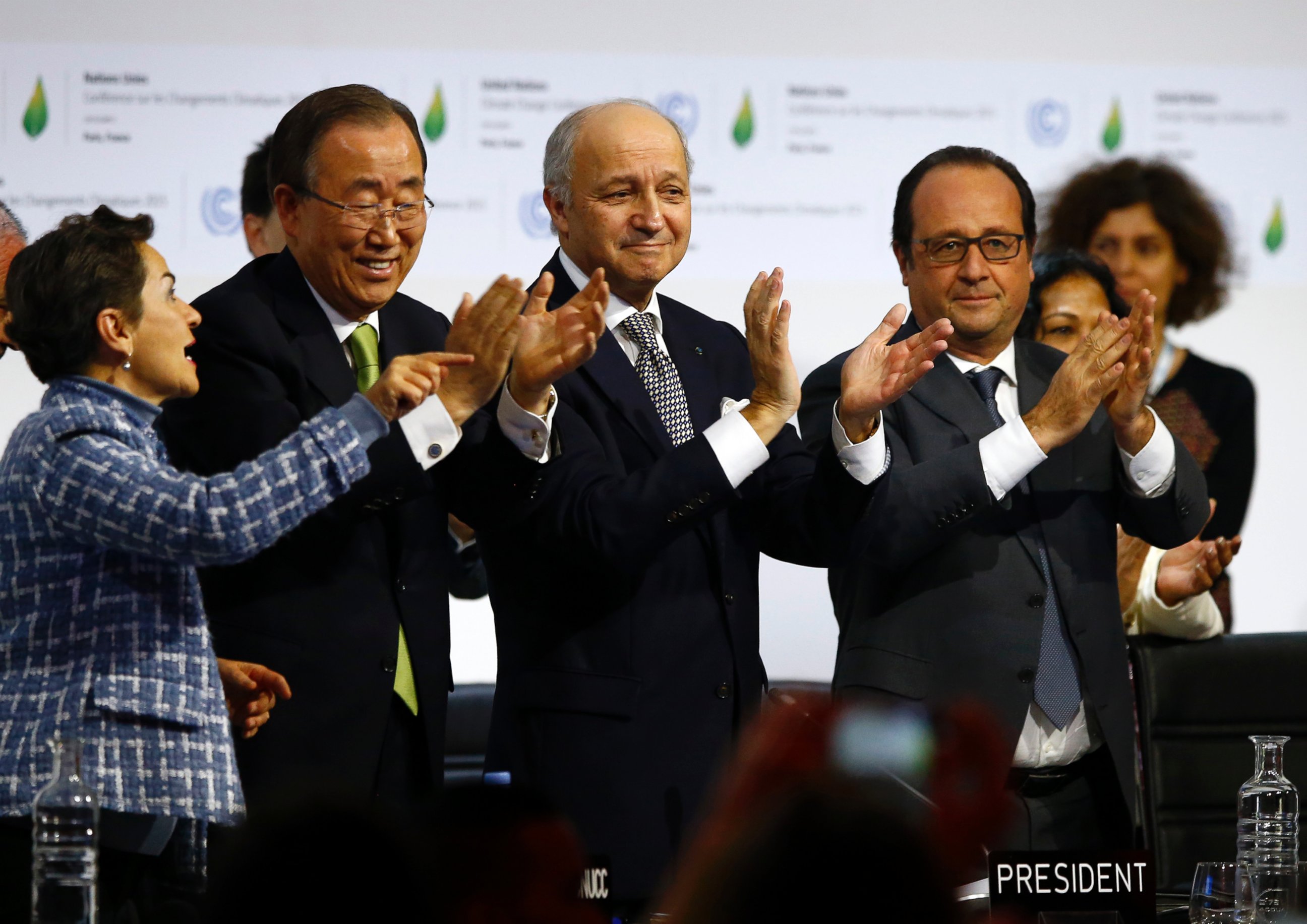 PHOTO: U.N. climate chief Christiana Figueres, U.N. Secretary General Ban ki-Moon, president of the COP21 Laurent Fabius and French President Francois Hollande applaud after the final conference at the COP21, in Le Bourget France, April 22, 2016.