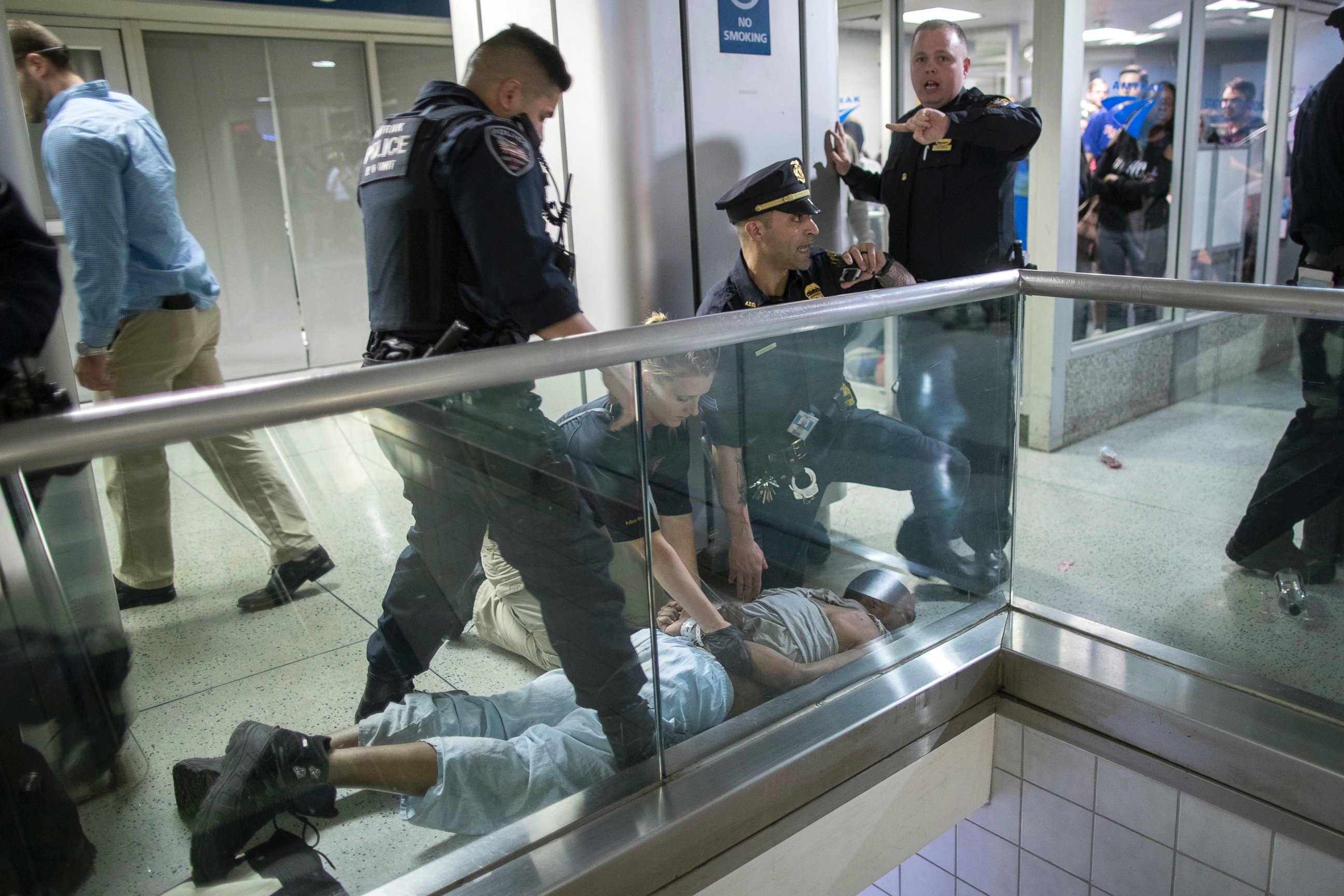 PHOTO: New York City police officers detain a passenger from a disabled New Jersey Transit train at New York's Penn Station, April 14, 2017. 