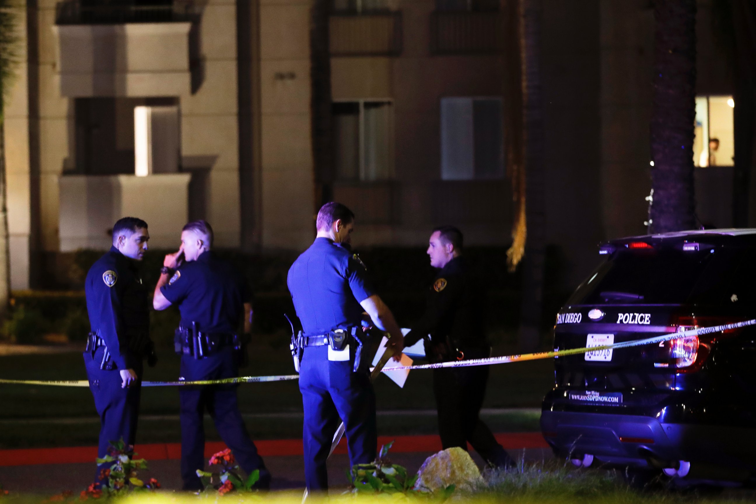 PHOTO: San Diego police officers stand in front of a cordoned off La Jolla apartment after a shooting, April 30, 2017, in San Diego. 