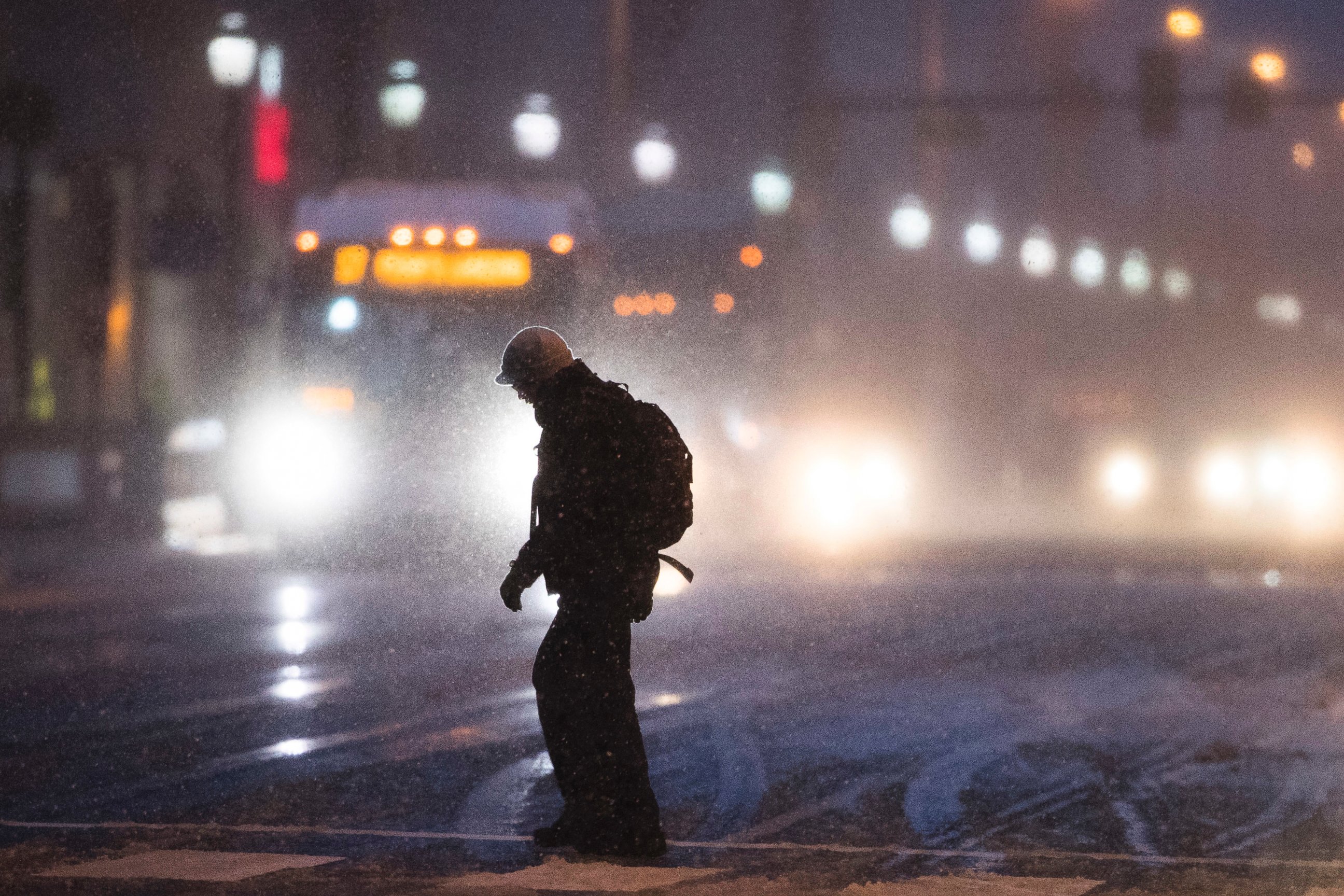 PHOTO: A man crosses Market Street during a winter storm in Philadelphia, Feb. 9, 2017.