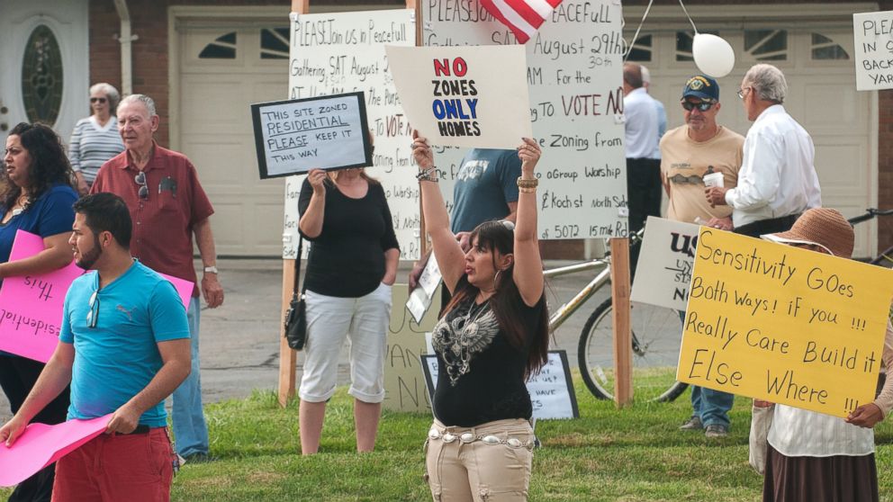Debbie Rosi, center, leads a protest of the construction of a mosque on 15 Mile Road in Sterling Heights, Michigan. They said they were concerned about traffic congestion and lowered property values. 