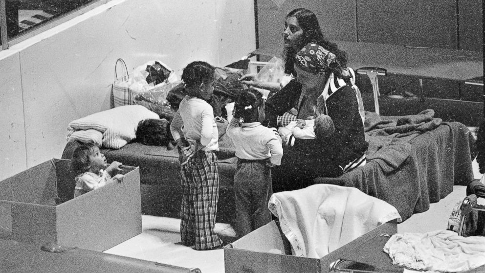 PHOTO: Kathy Moody uses a cardboard box for a playpen for her daughter while they wait in the evacuation center at Hershey sports arena for radiation from the Three Mile Island nuclear power plant to stop, March 31, 1979.