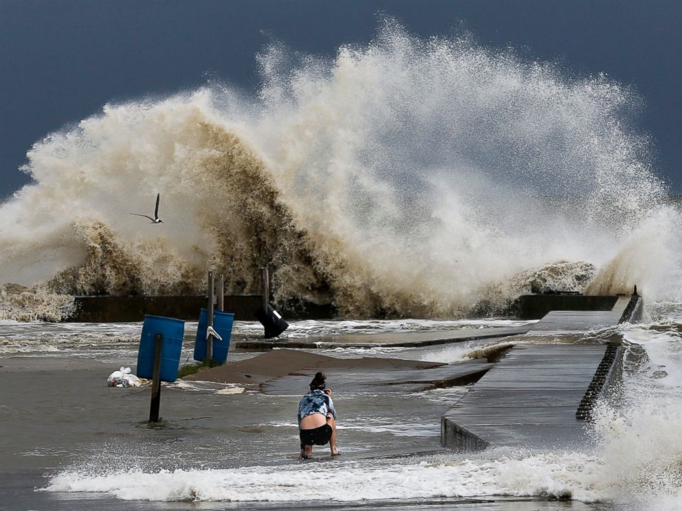 PHOTO: Sydney Schultz takes photos of waves crashing next to Rollover Pass as Tropical Storm Cindy approaches the coast, June 21, 2017 on the Bolivar Peninsula.