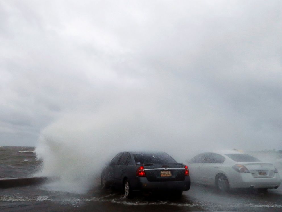 PHOTO: People sit in a car and watch the waves on the shore of Lake Pontchartrain as weather from Tropical Storm Cindy impacts the region in New Orleans, June 20, 2017.