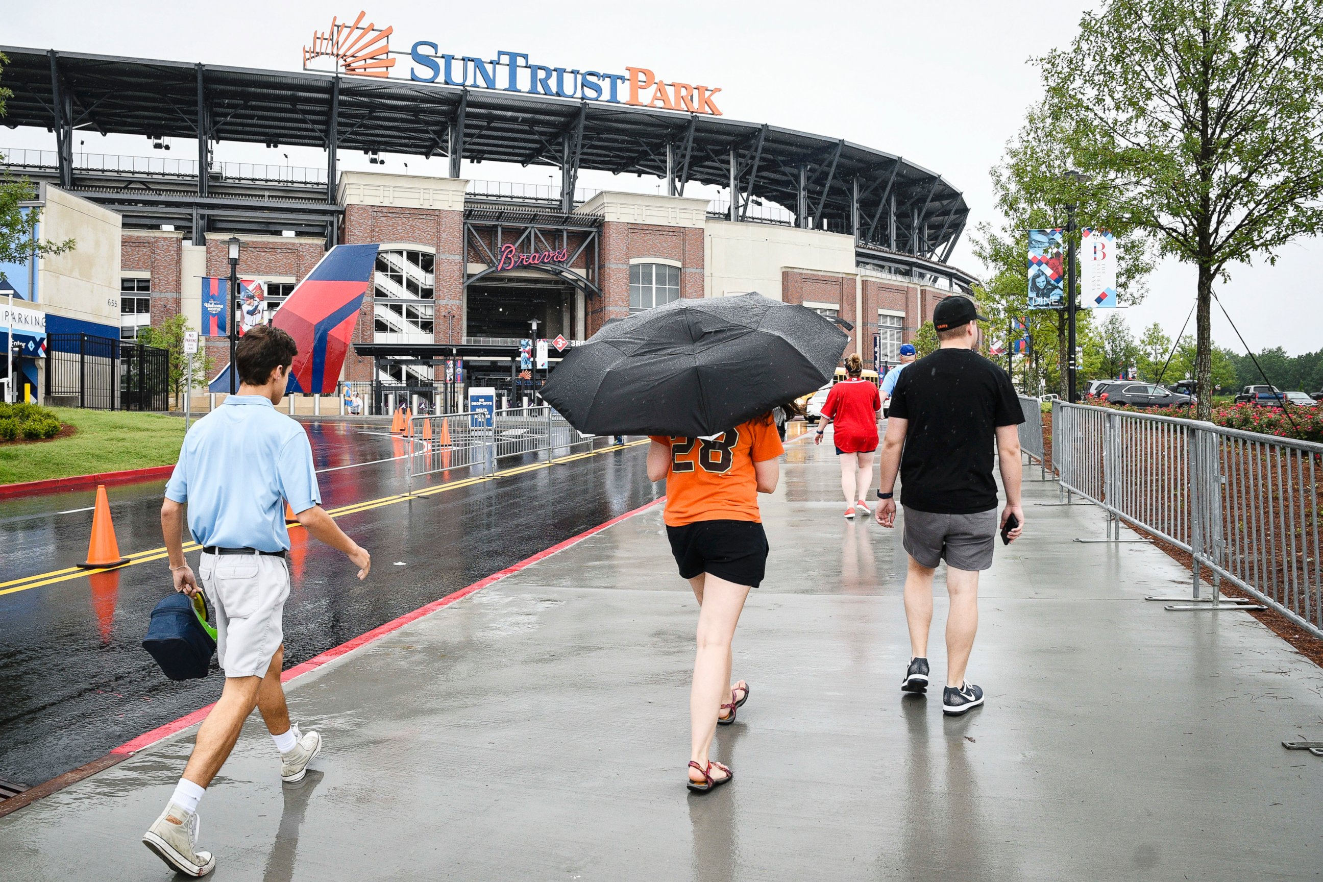 PHOTO: Fans arrive at SunTrust Park for a baseball game, June 20, 2017, in Atlanta. Tropical Storm Cindy has been causing rain in much of the Southeast.