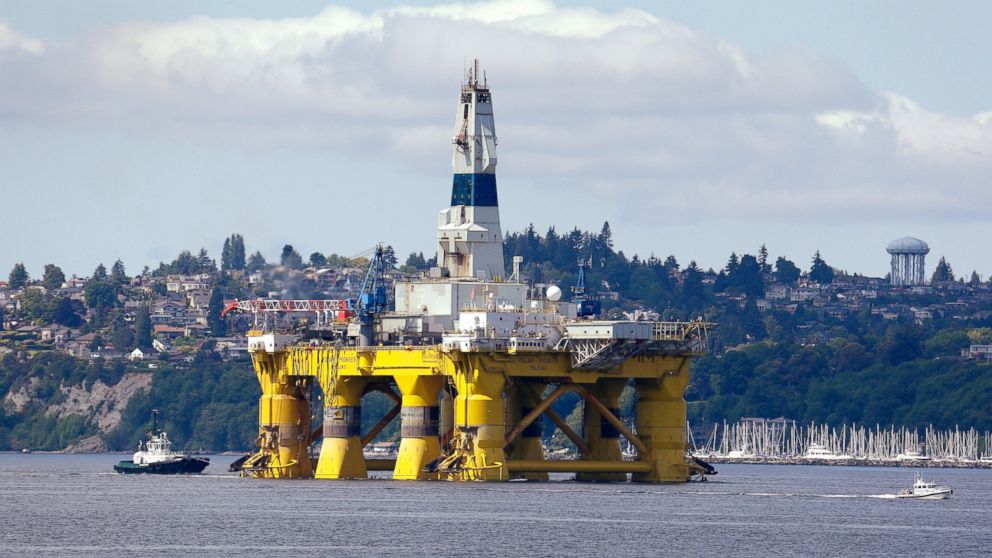 The oil drilling rig Polar Pioneer is towed toward a dock in Elliott Bay in Seattle. 