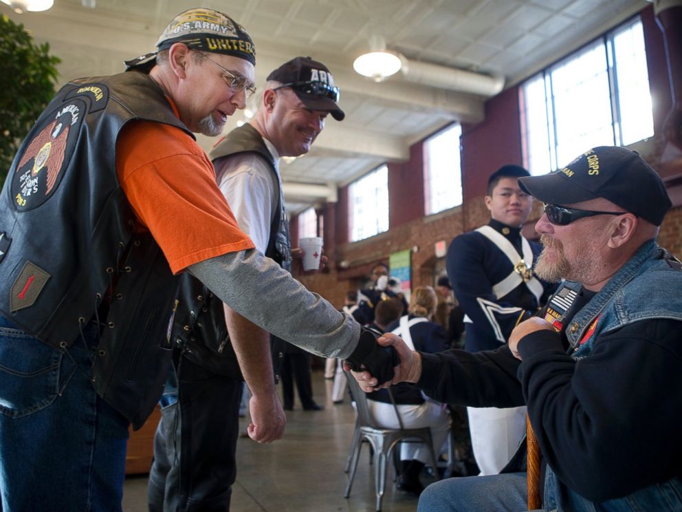 PHOTO: Joel Funk, of Salem, left, and Steve Lovelace, of Botetourt, center, both with the American Legion Riders, greet Vietnam War veteran Charles Shull of Roanoke prior to Virginias Veterans Parade, Nov. 5, 2016, in Roanoke, Virginia.