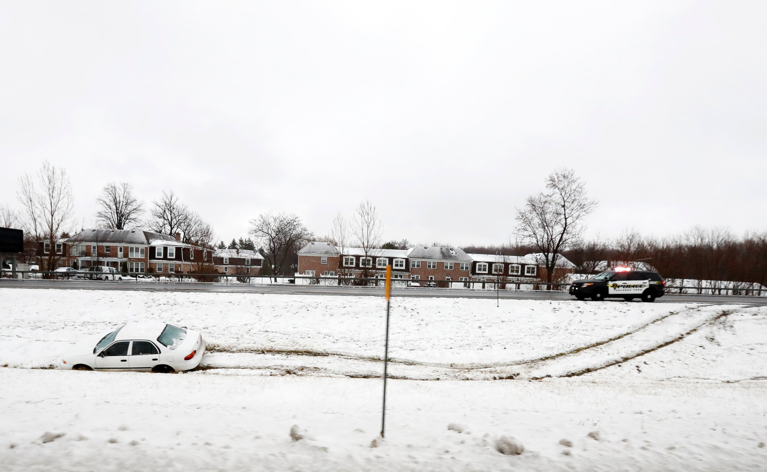 PHOTO: A vehicle rests in a median ditch after skidding into it on Route 219, Dec. 12, 2016, in Orchard Park, New York.