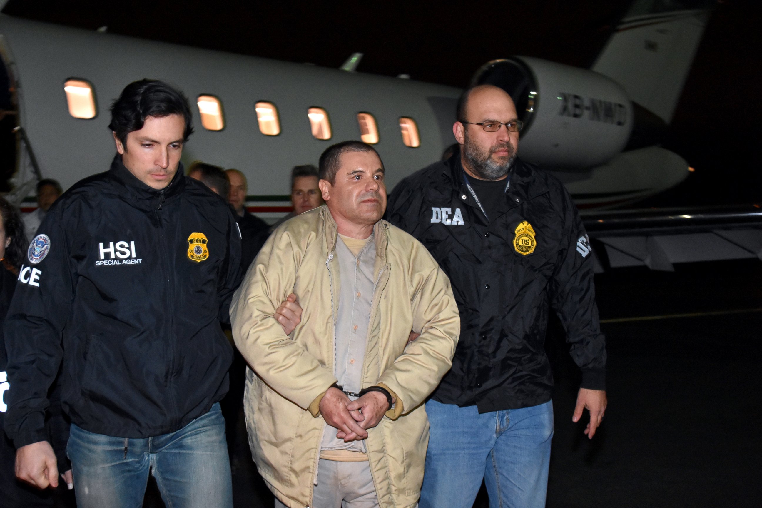 PHOTO: U.S. law enforcement, authorities escort Joaquin "El Chapo" Guzman from a plane at Long Island MacArthur Airport, Jan. 19, 2017, in Ronkonkoma, New York.