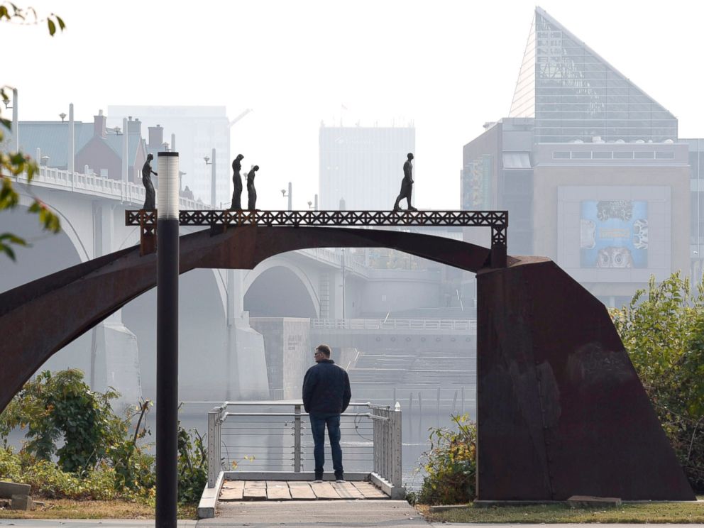 PHOTO: A smoky haze, from the numerous area wildfires, covers the Chattanooga Skyline as seen from Renaissance Park, Nov. 13, 2016.