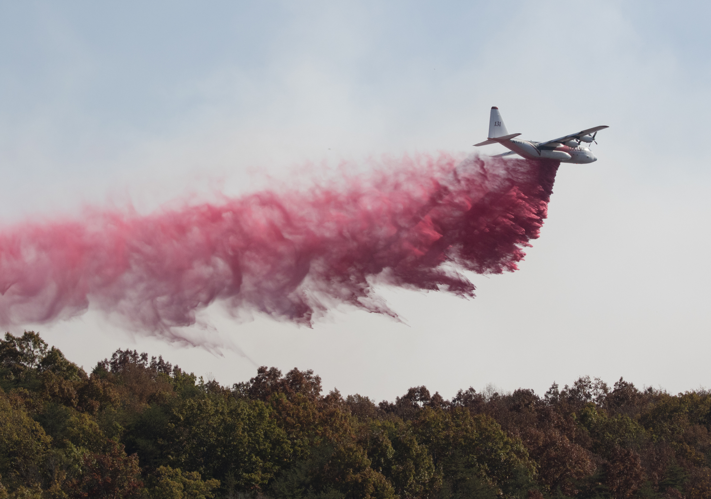 PHOTO: An aircraft from the US Forestry Service drops fire retardant on a wildfire burning along the Flipper Bend area of Signal Mountain in Hamilton County, Tennessee, Nov. 9, 2016.