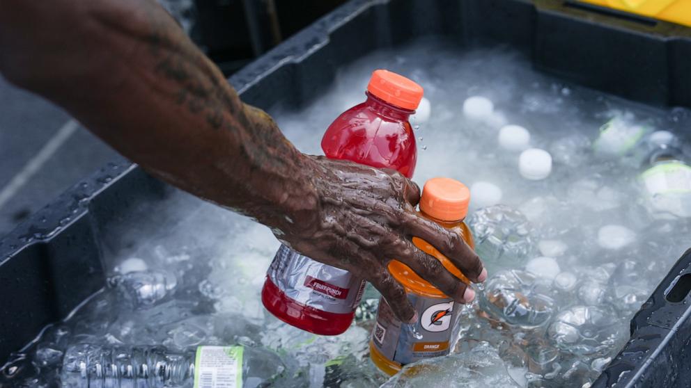 PHOTO: A vendor sells Gatorade and water bottles near the Washington Monument during a heat wave July 3, 2026, in Washington.