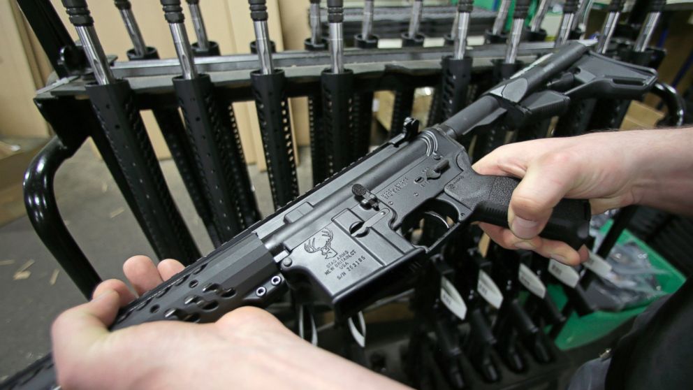 PHOTO: Craftsman Veetek Witkowski holds a newly assembled AR-15-style rifle at the Stag Arms company in New Britain, Conn. on April 10, 2013.