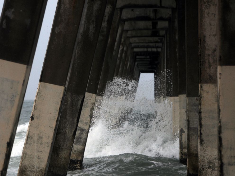 PHOTO: Waves crash around the Johnnie Mercers Fishing Pier at Wrightsville Beach, N.C., July 3, 2014.
