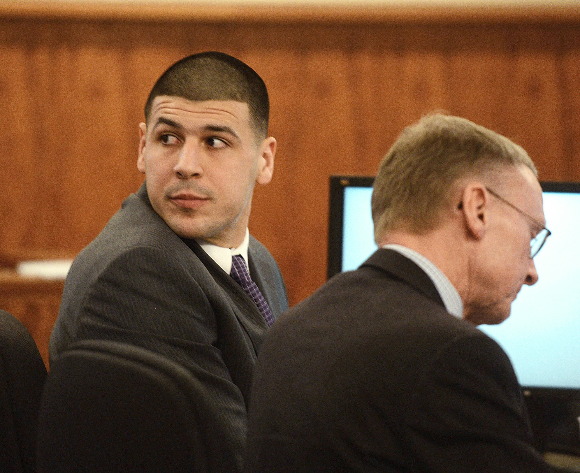 PHOTO: Aaron Hernandez, left, sits with his attorney Charles Rankin during his trial at Bristol Superior Court, Feb. 11, 2015, in Fall River, Mass. 