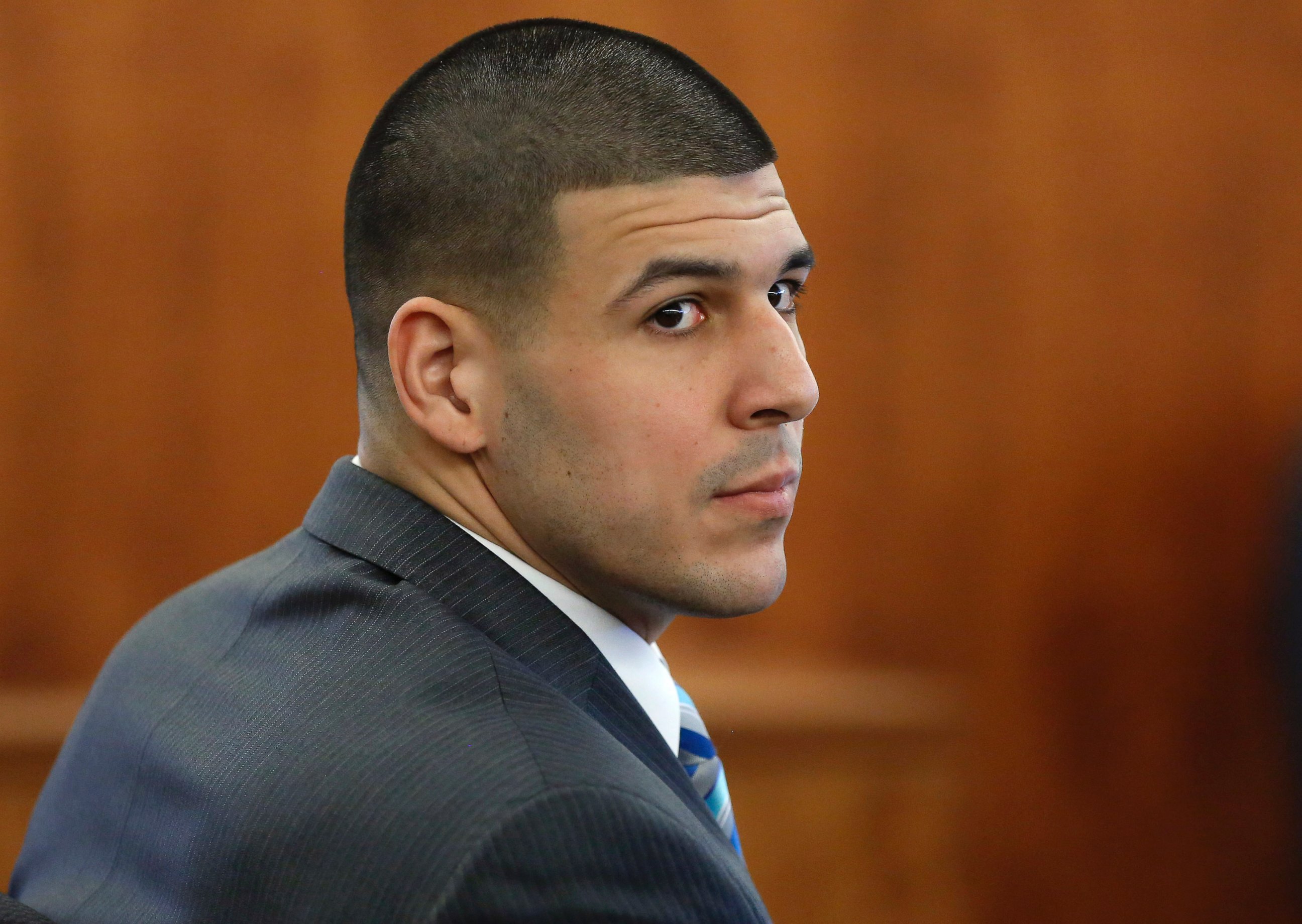 PHOTO: Former New England Patriots football player Aaron Hernandez sits during his murder trial, March 19, 2015, in Fall River, Mass.