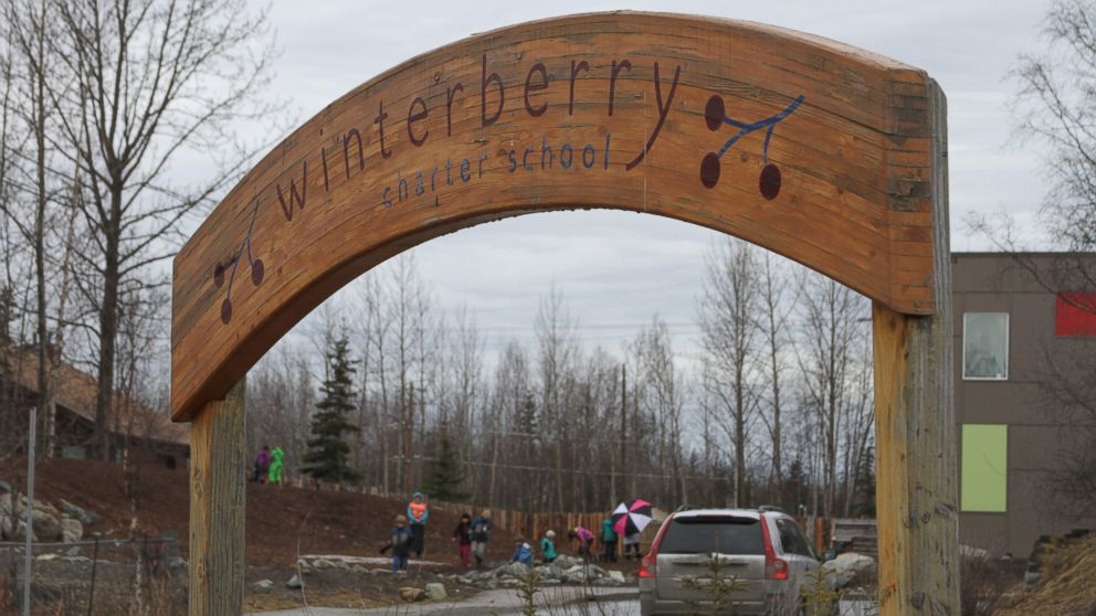 Children play outside Winterberry Charter School in Anchorage, Alaska, March 30, 2016.