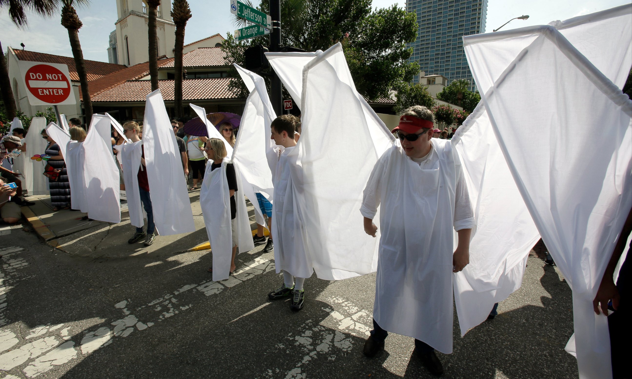 PHOTO: Counter demonstrators dressed as angels to show support and solidarity block the view of protesters near the funeral service for Christopher Andrew Leinonen, June 18, 2016, in Orlando -- one of the victims of the Pulse nightclub mass shooting.