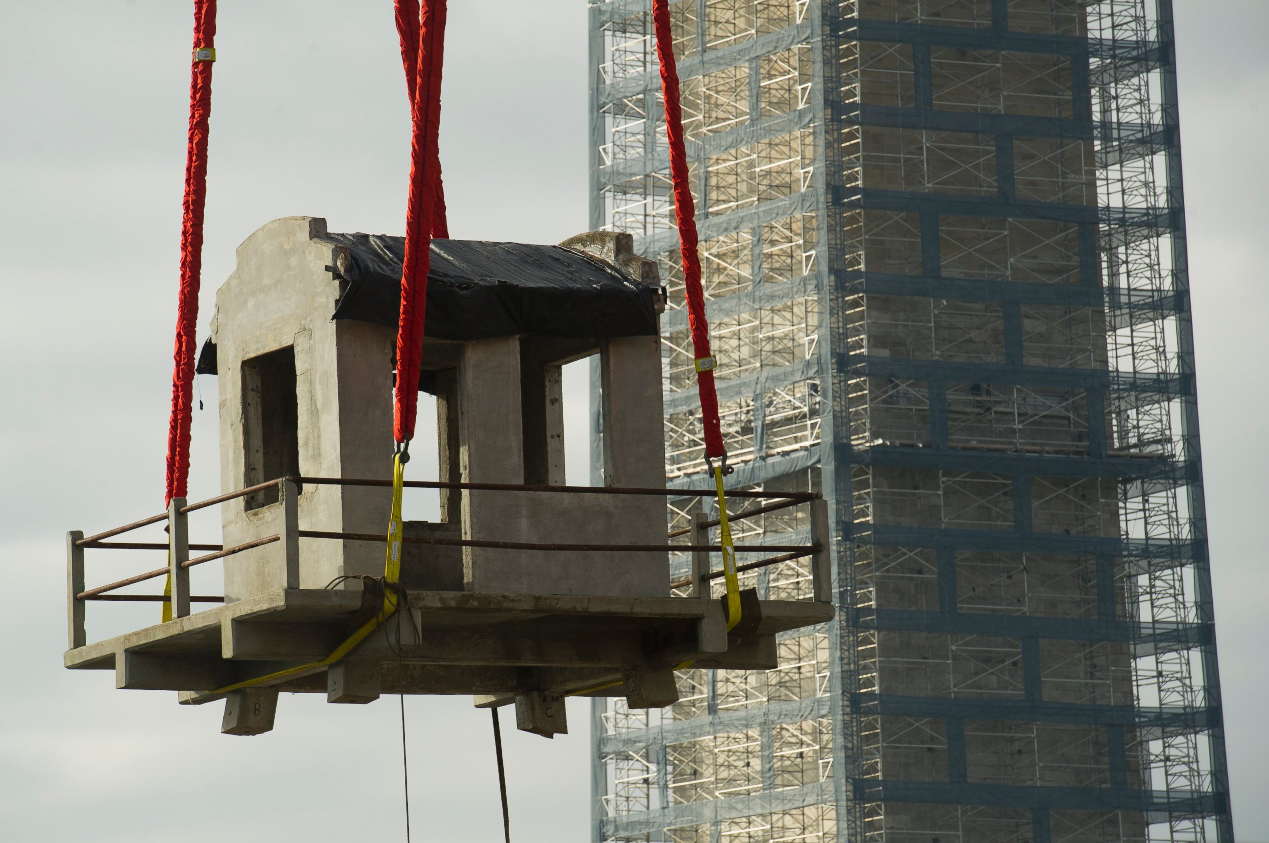 PHOTO: A guard tower from Louisiana State Penitentiary, also known as "Angola" and "The Farm" is lowered into the construction site of The National Museum of African American History and Culture in Washington, Nov. 17, 2013.