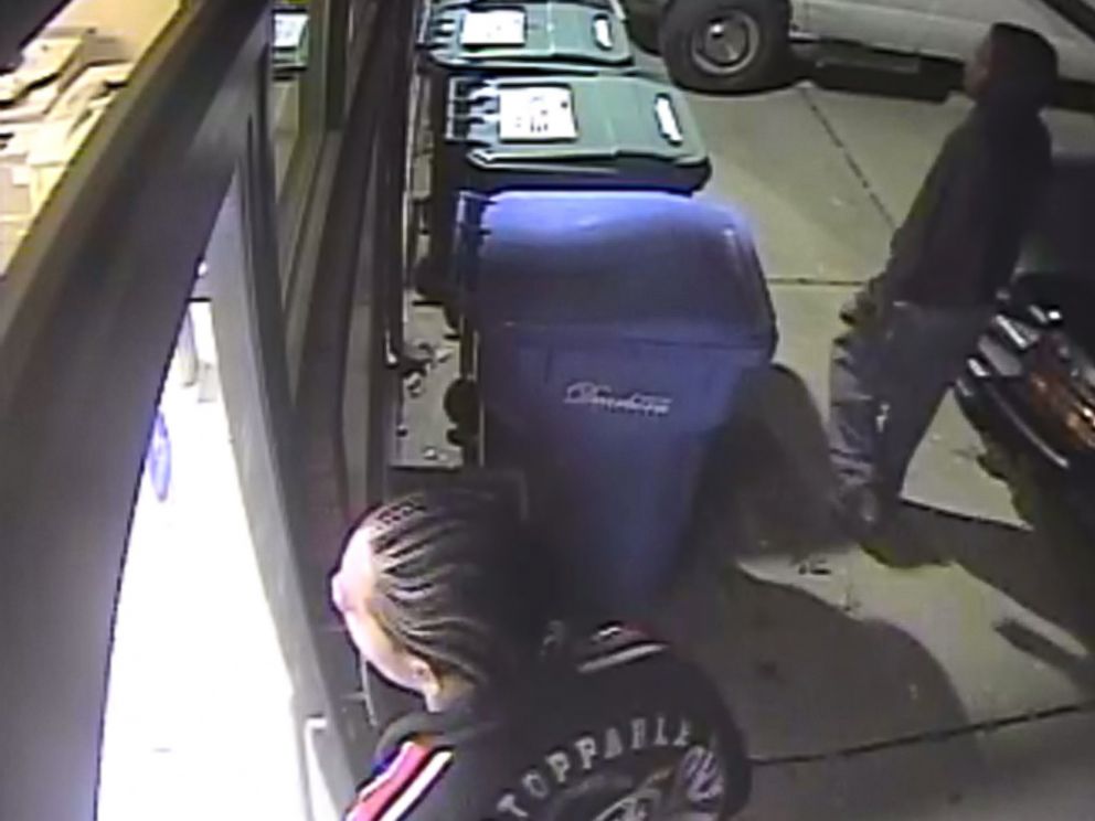PHOTO: This photo from video surveillance provided by the Dearborn Police Department shows two men trying to break into the offices of The Arab American News as employees worked to publish the newspaper.