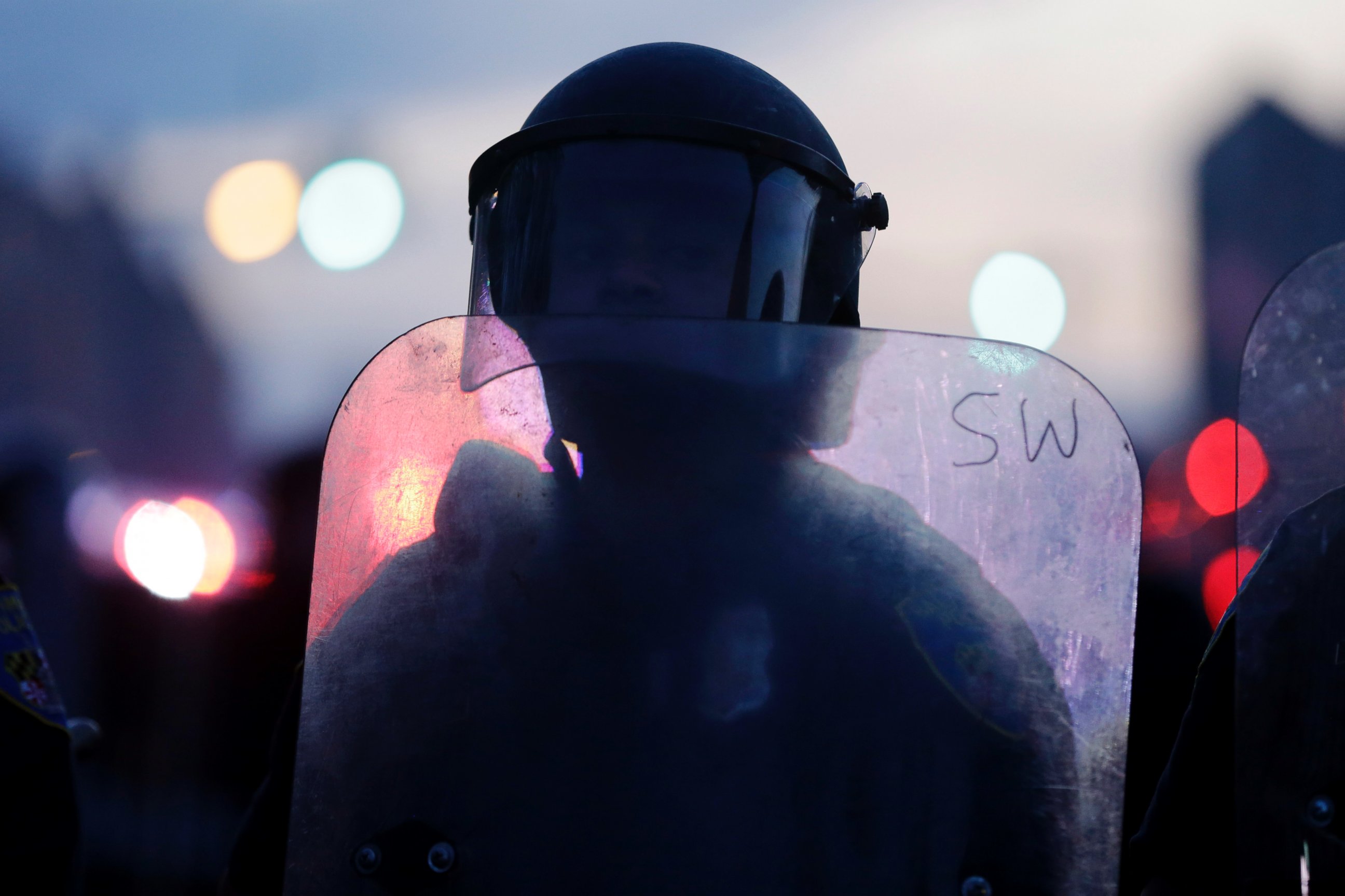 PHOTO: A police officer stands guard in Baltimore, April 27, 2015, after violence erupted in the city.