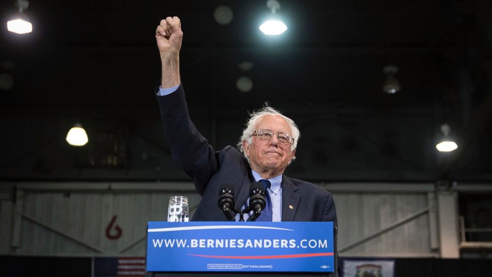 Democratic presidential candidate Sen. Bernie Sanders raises his fist to acknowledge the crowd before he speaks during an election night campaign event at the Big Sandy Superstore Arena, April 26, 2016, in Huntington, W.Va.