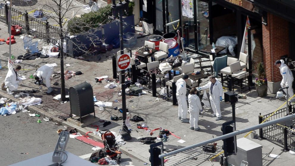 PHOTO:This April 15, 2013 and April 10, 2014 photos show a view of Boylston Street in front of the Forum restaurant, where investigators comb for evidence at the site where the second of two bombs exploded near the finish line of the 2013 Boston Marathon.