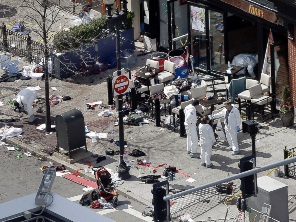 PHOTO:This April 15, 2013 and April 10, 2014 photos show a view of Boylston Street in front of the Forum restaurant, where investigators comb for evidence at the site where the second of two bombs exploded near the finish line of the 2013 Boston Marathon.