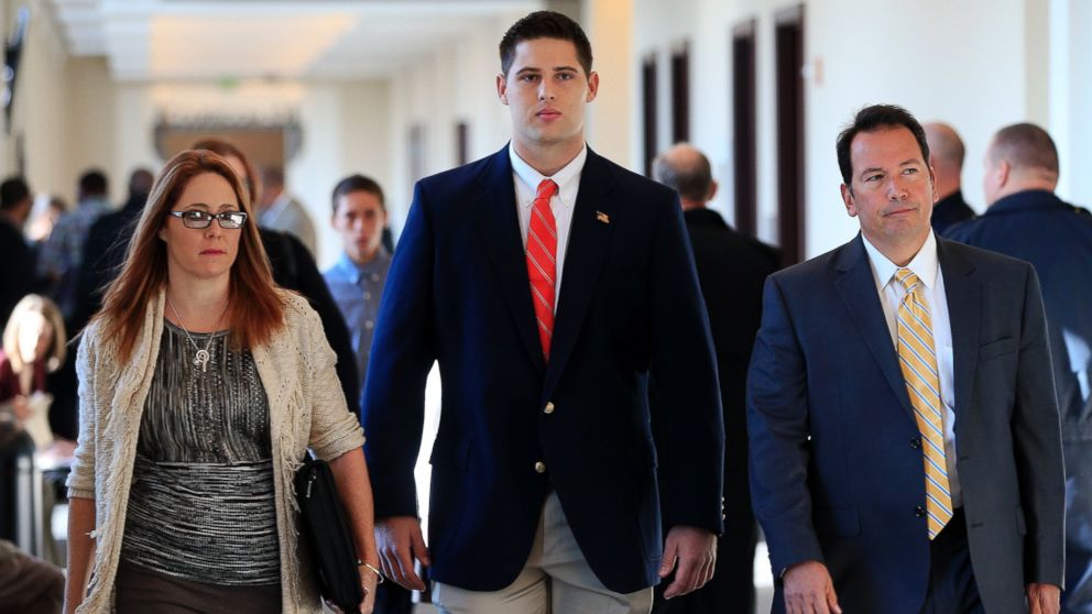Former Vanderbilt University football player Brandon Vandenburg, center, arrives for jury selection in his trial, Nov. 3, 2014, in Nashville, Tenn.  