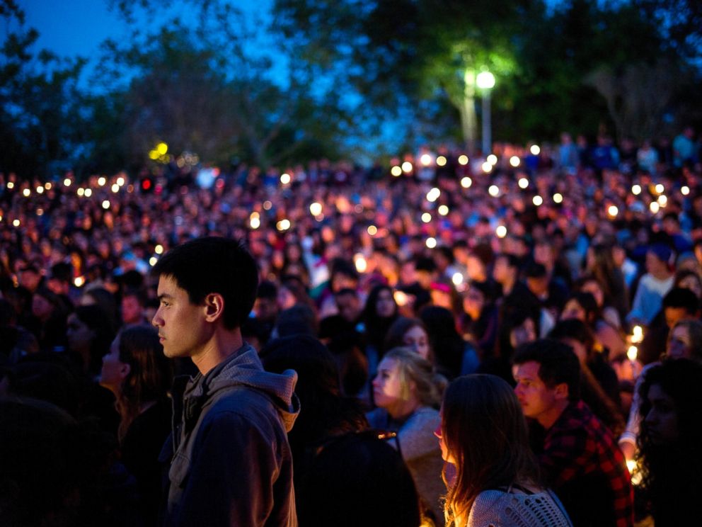 PHOTO: People gather at a park for a candlelight vigil, May 24, 2014, to honor the victims of a mass shooting in Isla Vista, Calif.
