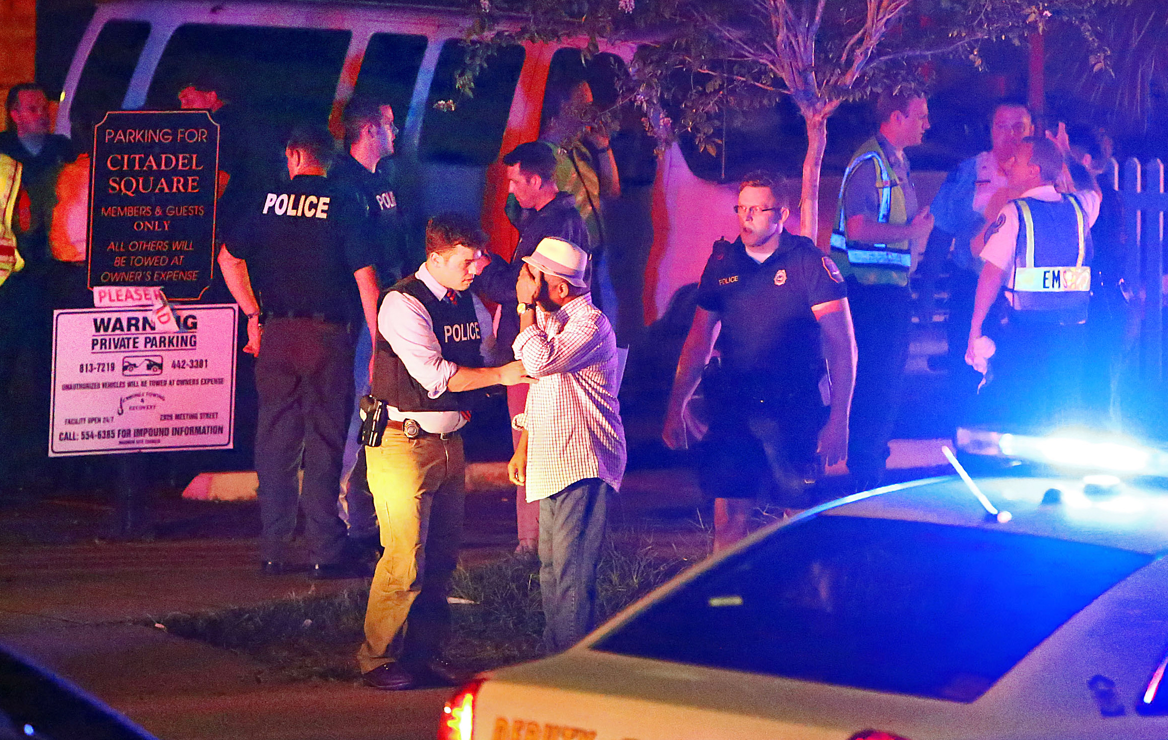 PHOTO: Police talk to a man outside the Emanuel AME Church following a shooting, June 17, 2015, in Charleston, South Carolina.