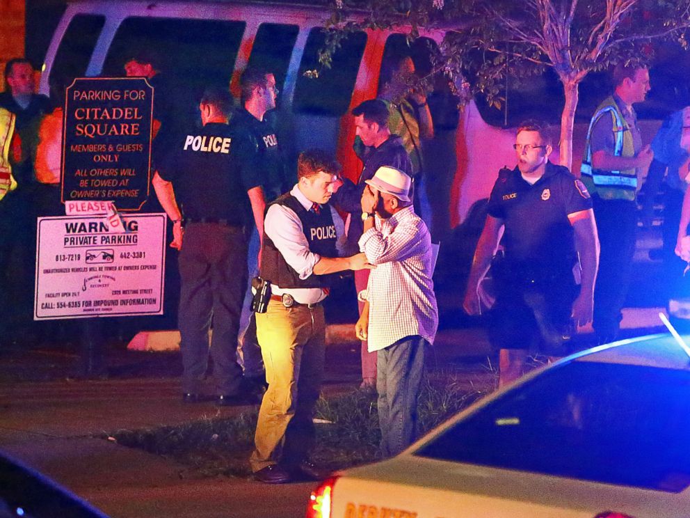 PHOTO: Police talk to a man outside the Emanuel AME Church following a shooting, June 17, 2015, in Charleston, South Carolina.