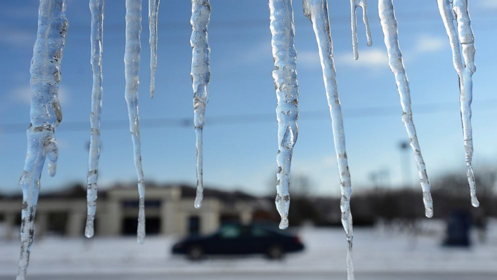 Icicles hang from a building, Feb. 18, 2015, in Nolensville, Tenn.