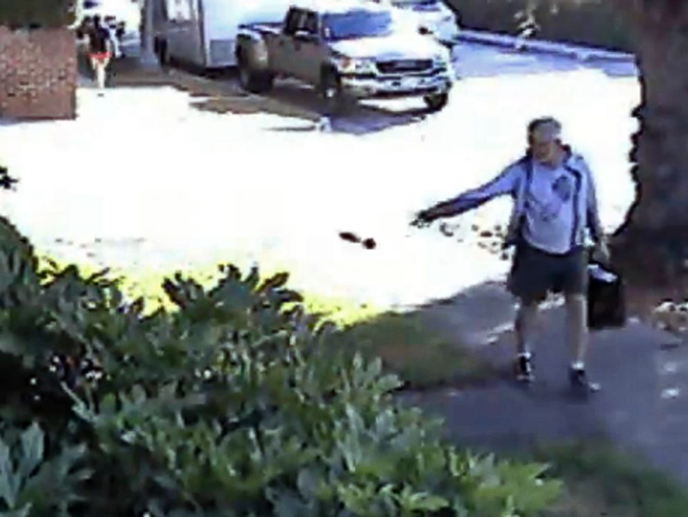 PHOTO: In this June 7, 2014 image from from a security video provided by Philip Lao, Dennis Kneier, the mayor of San Marino, Calif., tosses a bag of dog waste onto Lao's property.