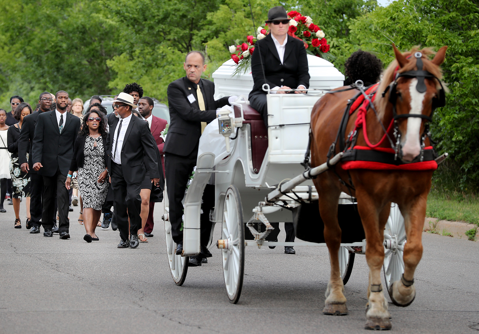 PHOTO: The funeral procession for Philando Castile makes its way along Concordia Avenue to The Cathedral of Saint Paul, July 14, 2016, in St. Paul, Minnesota. 