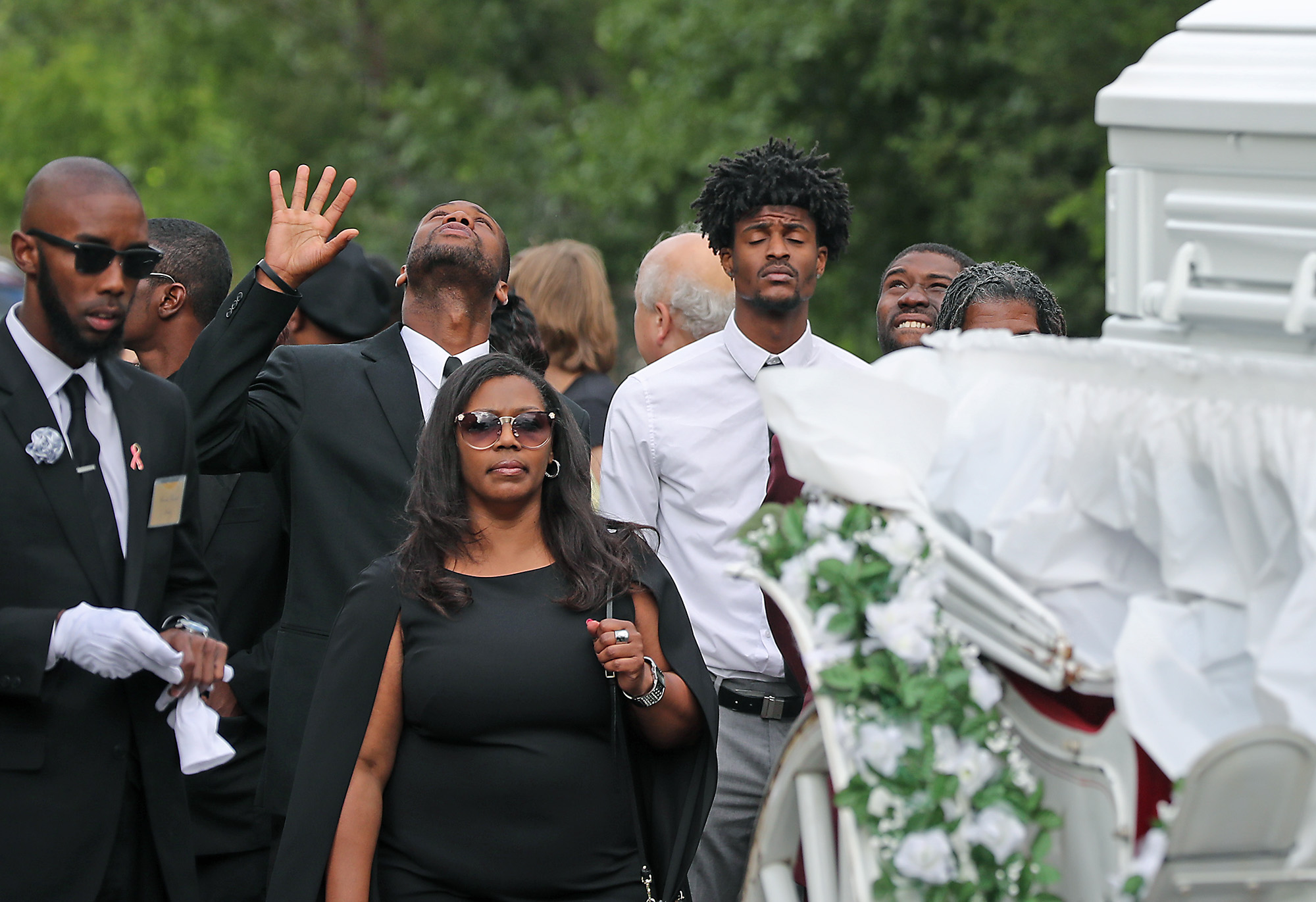 PHOTO: Friends and family follow the funeral procession for Philando Castile as it makes its way along Concordia Avenue to The Cathedral of Saint Paul, July 14, 2016, in St. Paul, Minnesota. 