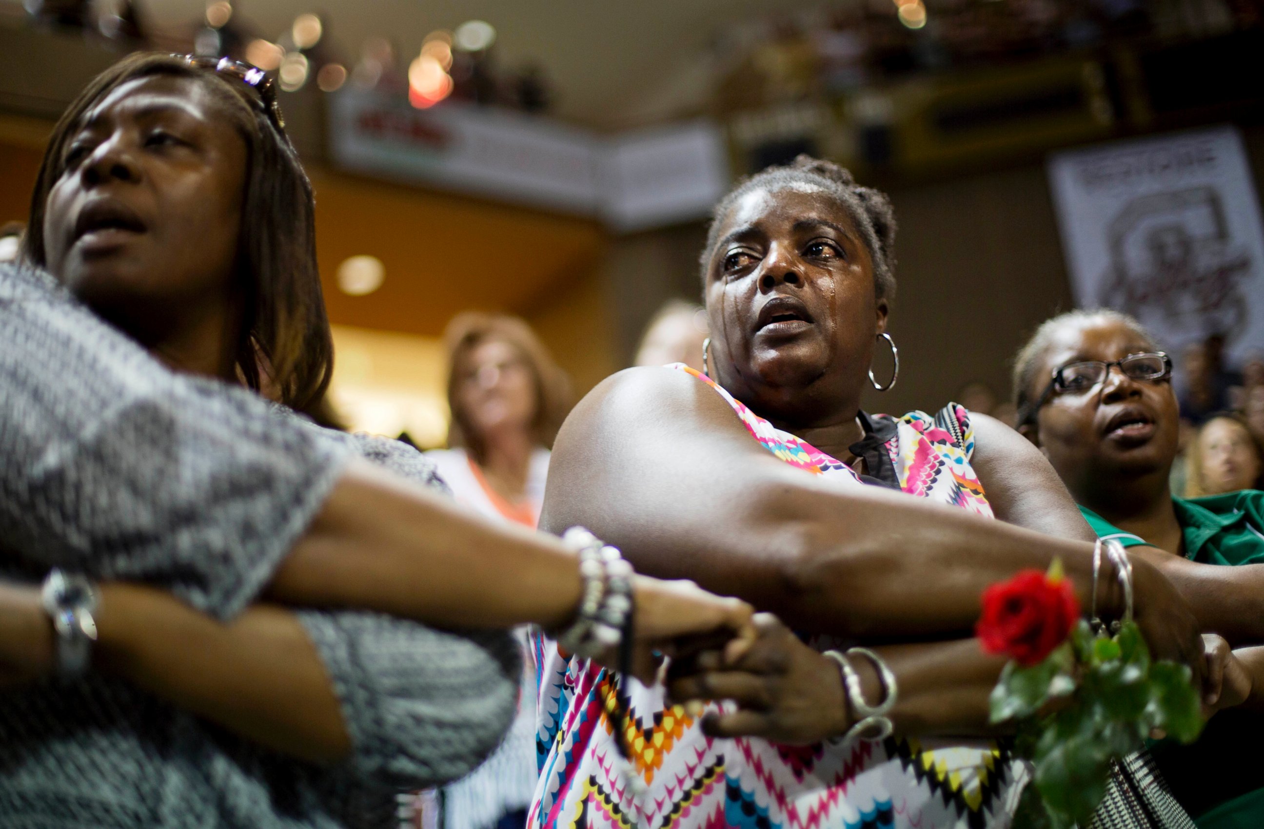 PHOTO: Barbara Lloyd, of Charleston, S.C., cries as she joins hands with mourners during the singing of "We Shall Overcome" at a memorial service for the victims of the shooting at Emanuel AME Church, Friday, June 19, 2015, in Charleston, S.C. 