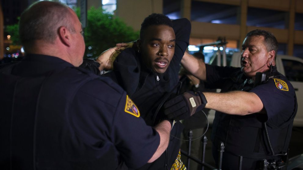 PHOTO: A demonstrator is arrested during a protest against the acquittal of Michael Brelo, a patrolman charged in the shooting deaths of two unarmed suspects, Saturday, May 23, 2015, in Cleveland.