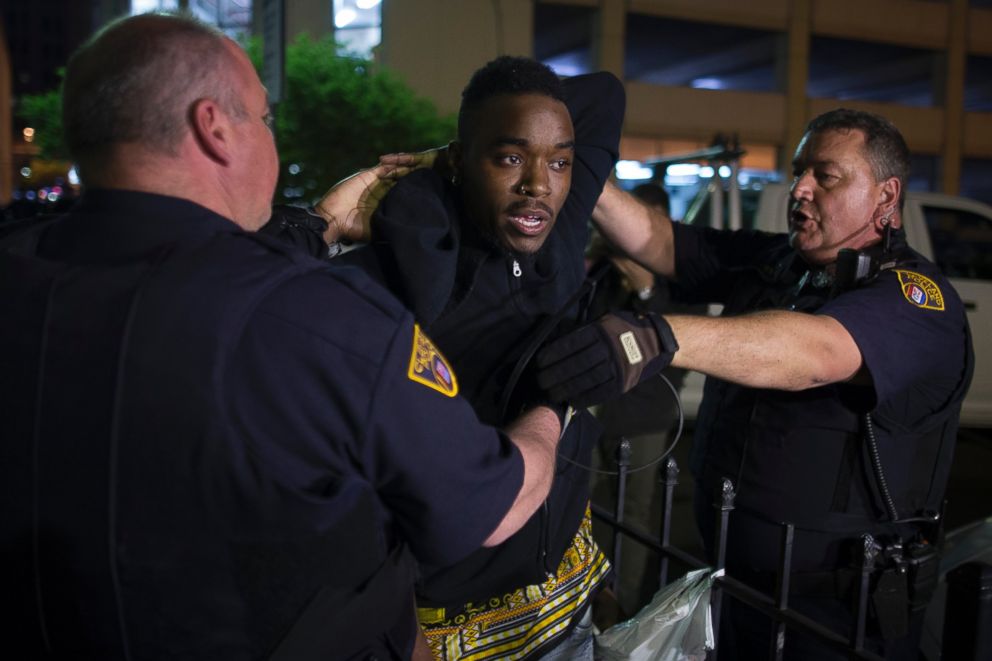 PHOTO: A demonstrator is arrested during a protest against the acquittal of Michael Brelo, a patrolman charged in the shooting deaths of two unarmed suspects, Saturday, May 23, 2015, in Cleveland.