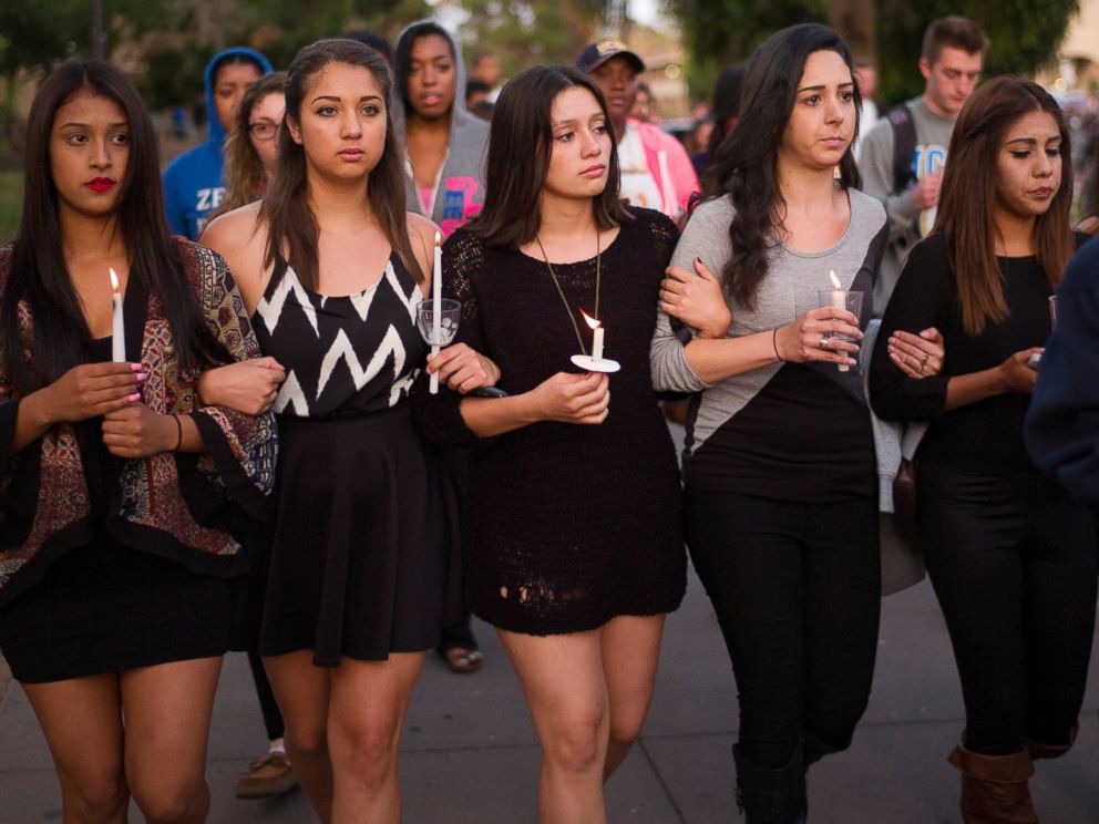 PHOTO: Students march on the campus of the University of California, Santa Barbara during a candlelight vigil held to honor the victims of Friday nights mass shooting on May 24, 2014, in Isla Vista, Calif.