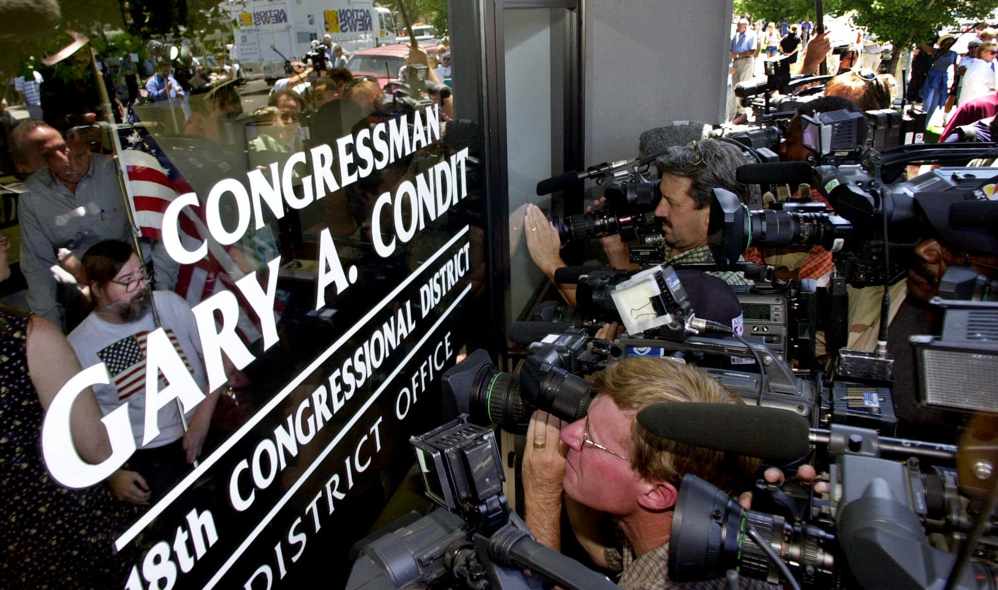 PHOTO: A group of demonstrators present a letter calling for his resignation inside of Rep. Gary Condit's office in Modesto, California, on July 17, 2001.