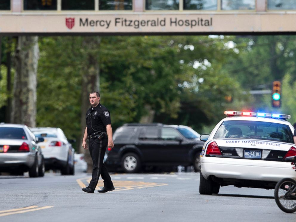 PHOTO: An officer directs traffic near the scene of a shooting Thursday, July 24, 2014, at a wellness center attached to Mercy Fitzgerald Hospital in Darby, Pa.