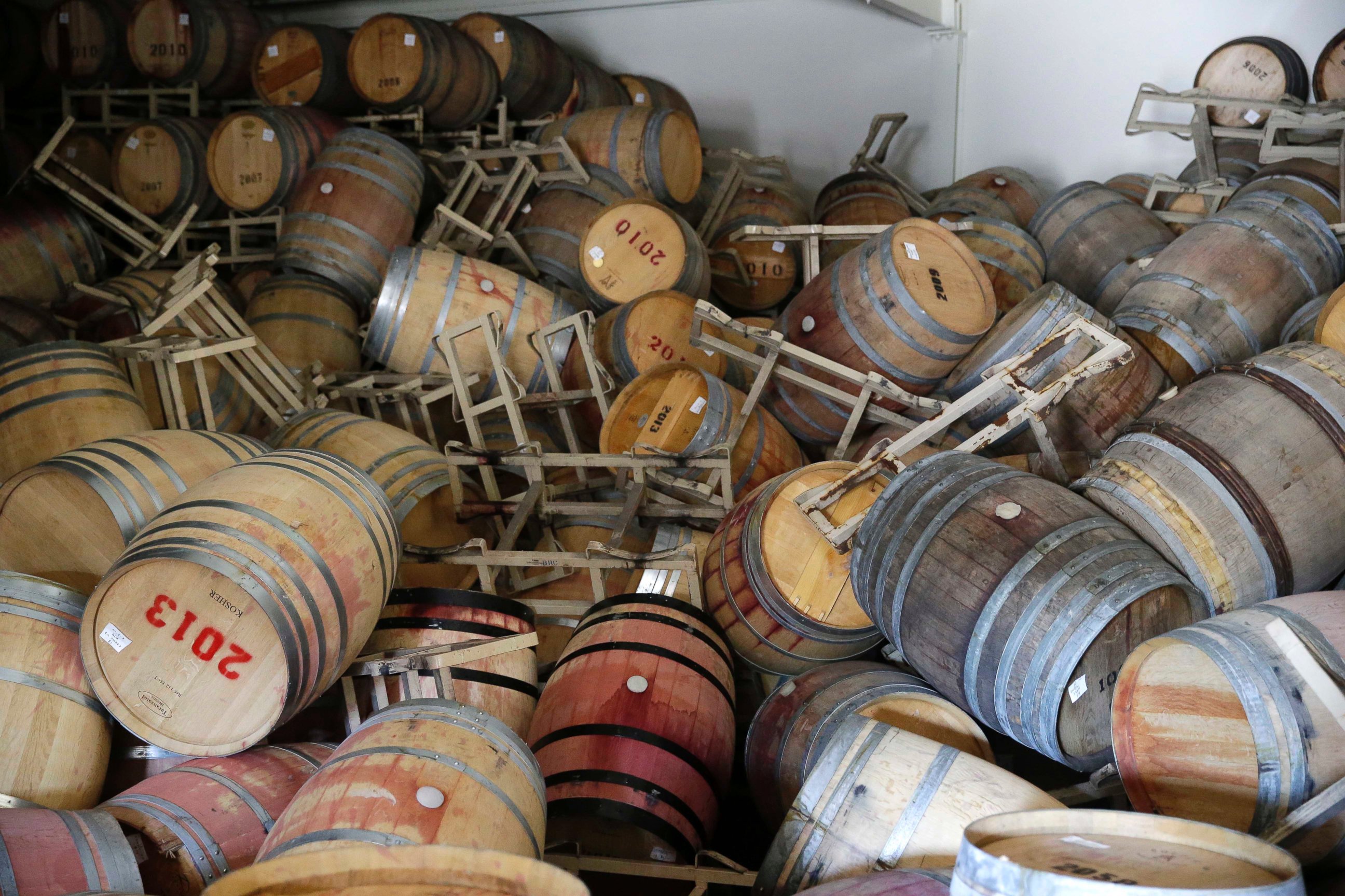 PHOTO: Barrels filled with Cabernet Sauvignon are toppled on one another following an earthquake at the B.R. Cohn Winery barrel storage facility, Aug. 24, 2014, in Napa, Calif.