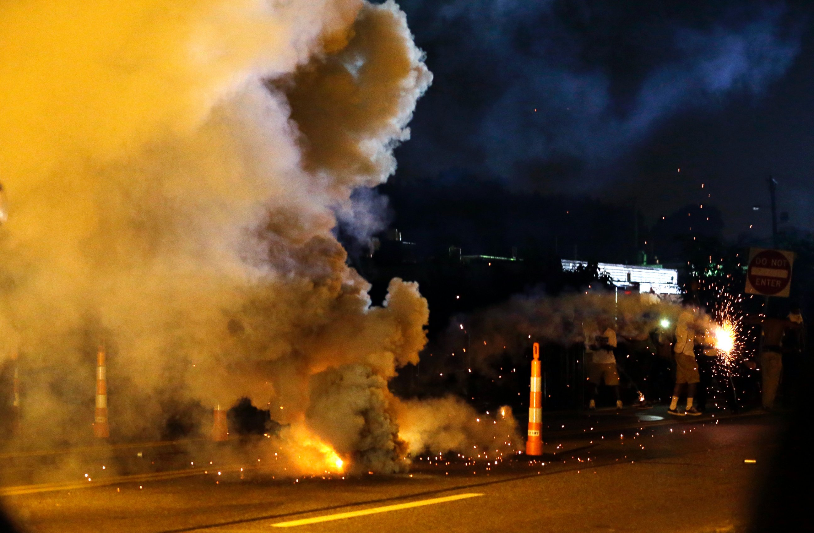 PHOTO: Tear gas is deployed after police were fired upon, Aug. 18, 2014, in Ferguson, Mo.