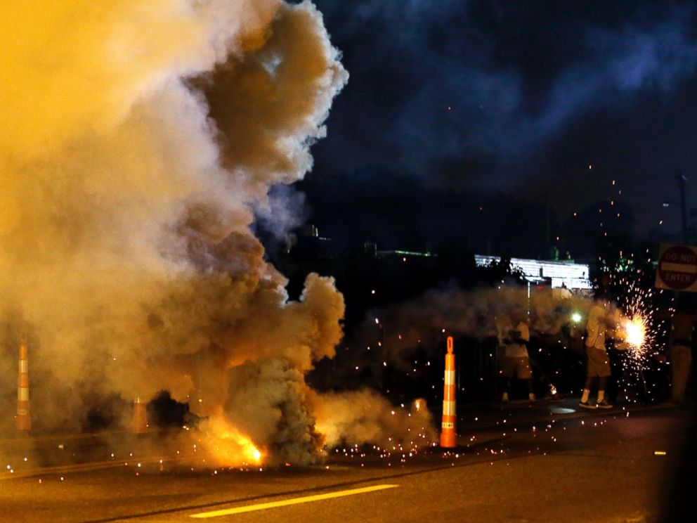 PHOTO: Tear gas is deployed after police were fired upon, Aug. 18, 2014, in Ferguson, Mo.