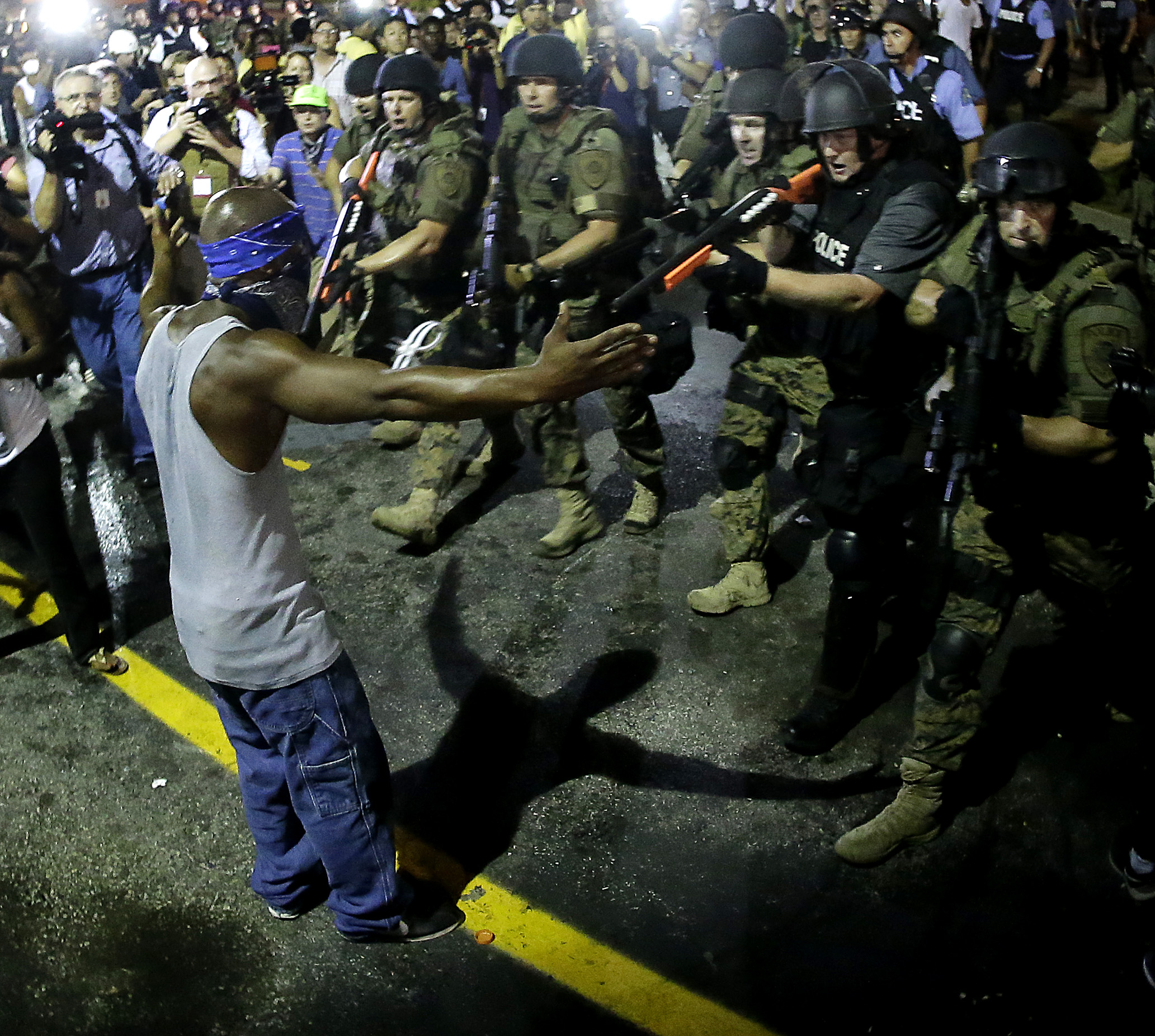 PHOTO: Police arrest a man as they disperse a protest in Ferguson, Mo., Aug. 20, 2014.