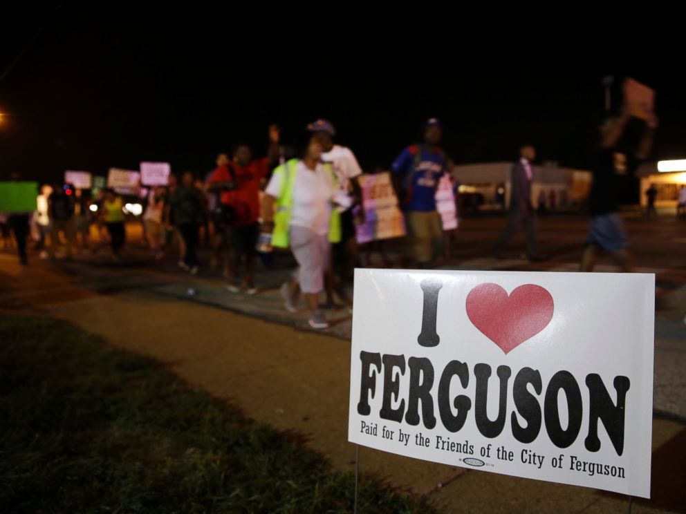 PHOTO: Protesters march, Aug. 21, 2014, in Ferguson, Mo.