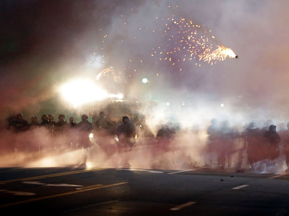 PHOTO: An explosive device deployed by police flies in the air as police and protesters clash, Aug. 13, 2014, in Ferguson, Mo.