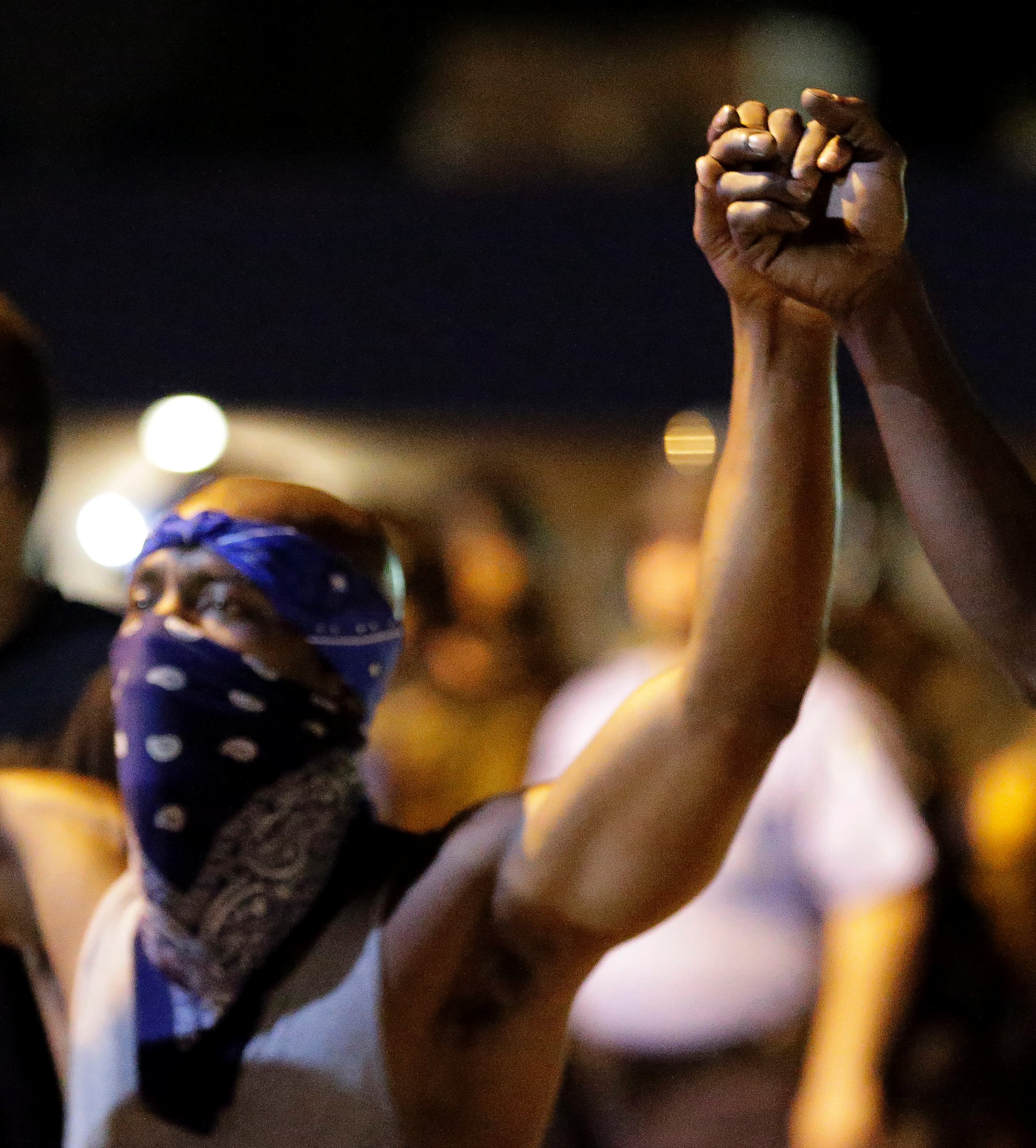 PHOTO: Protesters join hands during a protest in Ferguson, Mo., Aug. 20, 2014.